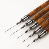 Komall nail art brush 4mm for precise gel line work.