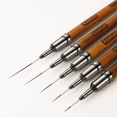 Komall nail art brush 4mm for precise gel line work.
