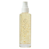 Kopari Golden Aura Oil bottle closeup highlighting deep hydration and glow.