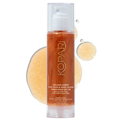 Kopari Sun Shield Body Glow bottle showing golden amber SPF glow for protected radiance.