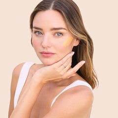 KORA Organics Turmeric Glow Moisturizer cream texture showing smooth consistency for skin