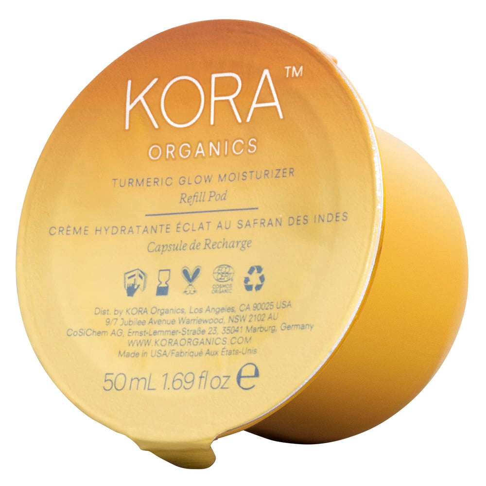 KORA Organics Turmeric Glow Moisturizer refill pod close-up for sustainable packaging promoting hydration