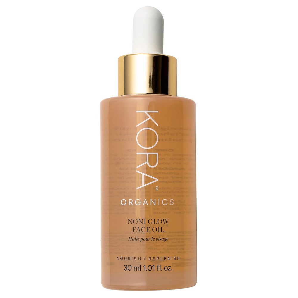 KORA Organics Noni Glow oil bottle closeup for radiant, hydrating skin care