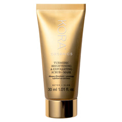 KORA Organics Turmeric Brightening Exfoliating Mask jar closeup showing product details and glow benefits