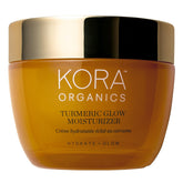 KORA Organics Turmeric Glow Moisturizer jar closeup showing creamy texture and hydration