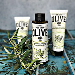 KORRES olive oil shower gel foam close-up demonstrates soothing hydration.