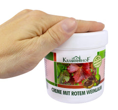 Krauterhof cream being applied to legs for soothing relief after activity