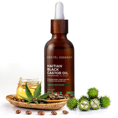 KREYÒL ESSENCE rosemary peppermint blend bottle highlighting calming scalp care.