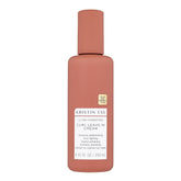 Kristin Ess Ultra Hydrating Curl Leave-In Cream bottle close-up showing hydrated curls.