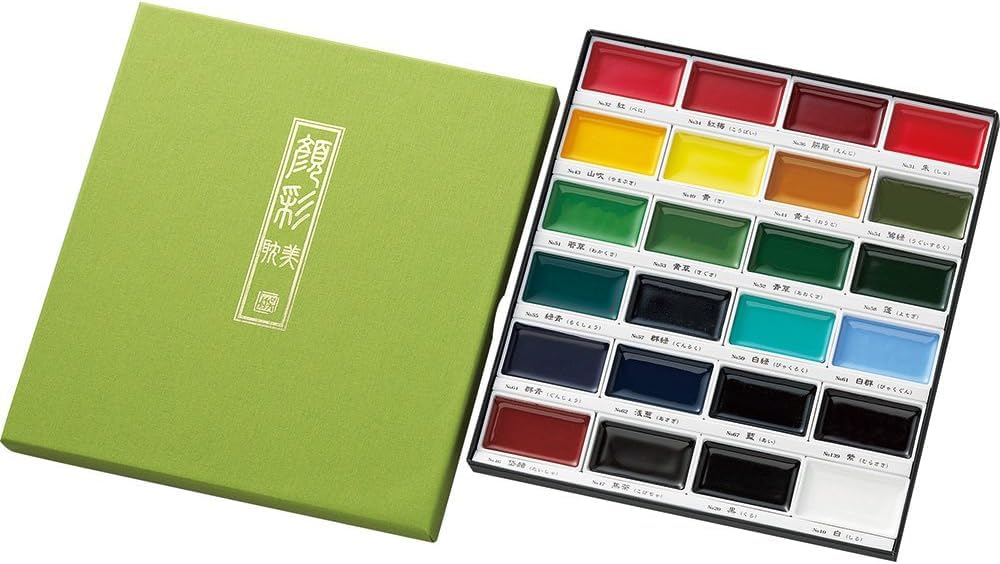 Kuretake Gansai Tambi 24-color pans close-up showing vibrant pigment for rich strokes.