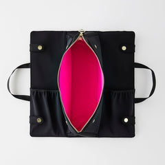 KUSSHI elasticized pockets secure brushes and accessories for easy access.