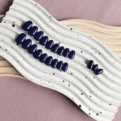 KXAMELIE navy blue press-on nails packaging and 24-piece set