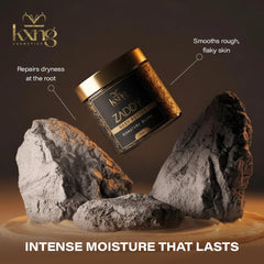 KXNG Cosmetics Organic Shea Body Butter cream on feet to combat dry skin.