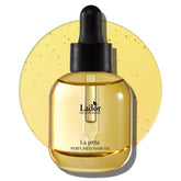 LA'DOR hair perfume oil bottle closeup shows glossy finish and nourishing shine