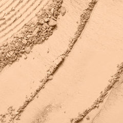 Lancôme Dual Finish powder foundation swatches showing buildable coverage