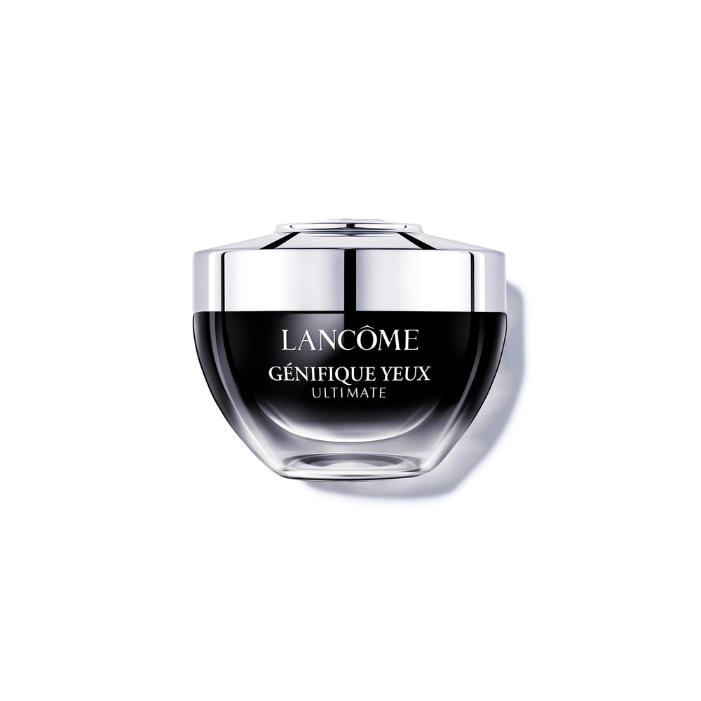 Lancôme Génifique Eye Cream tube close-up highlighting creamy hydration near the eye contour.
