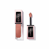 Lancôme Idôle Tint Hot Lava bottle closeup with warm copper shimmer for bold definition