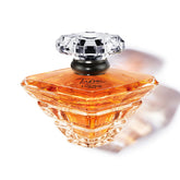 Lancôme Trésor EDP bottle displayed for timeless elegance on shelf.