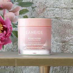 Laneige Peony & Collagen Complex swirl on cream surface suggests revitalization and firmness.