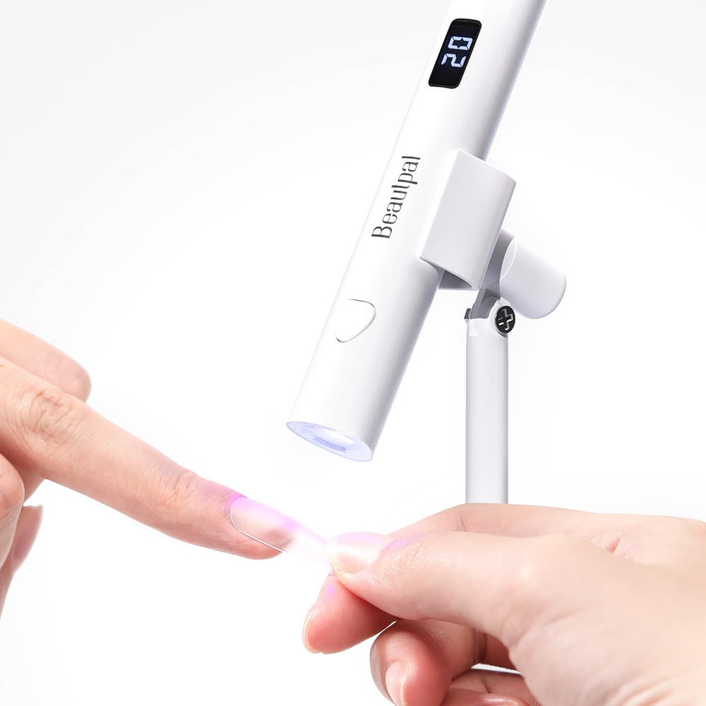 Larvall BEAUTPAL handheld UV light shown in use for quick at-home nail curing