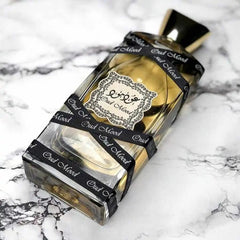 Lattafa Oud Mood top view showcases saffron and floral notes for daytime allure.