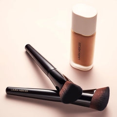 Laura Mercier Real Flawless Foundation Brush hand-application in action delivering skin-like finish.