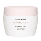 Laura Mercier Serum Body Cream pump bottle delivers silky texture and long-lasting hydration.