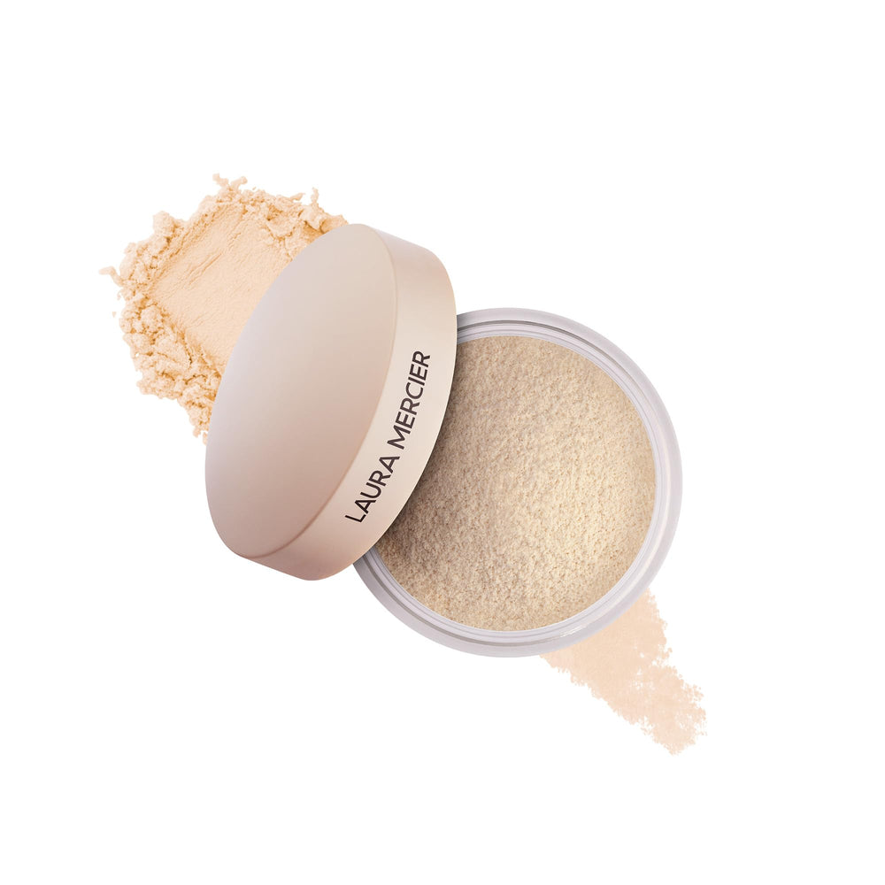 Laura Mercier translucent loose powder jar close-up demonstrates long-lasting setting.