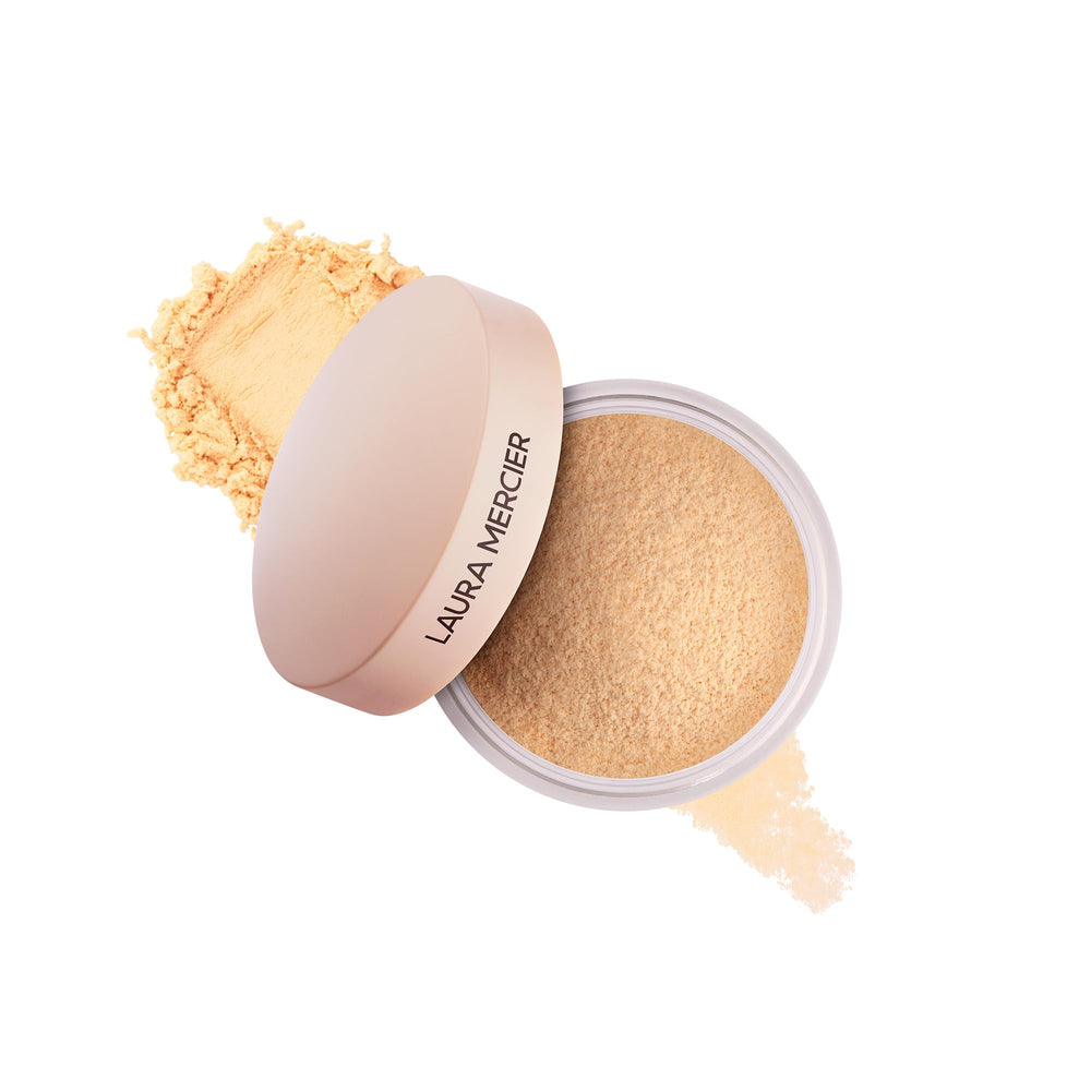 Laura Mercier translucent loose powder ultra blur honey mini packshot; travel-friendly soft-focus finish.