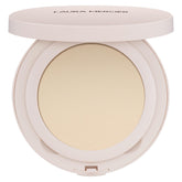 Laura Mercier Ultra-Blur powder compact closeup shows smooth texture and translucent finish.