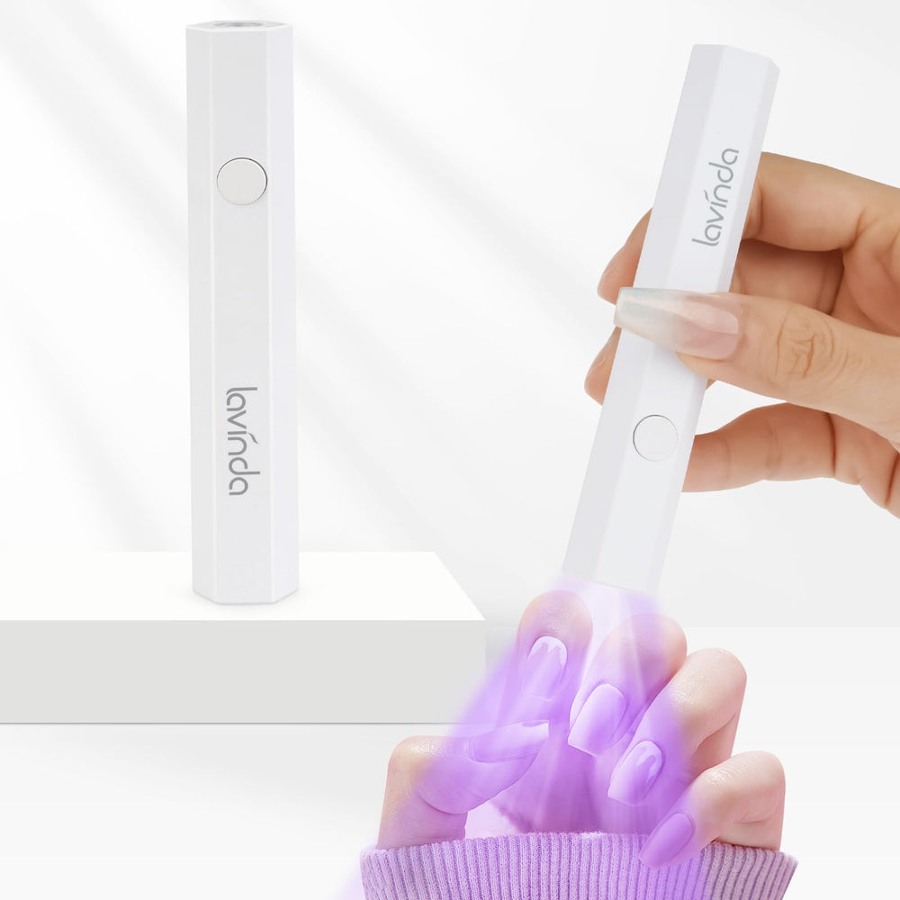 Lavinda handheld UV light drying base coat in seconds for faster manicures