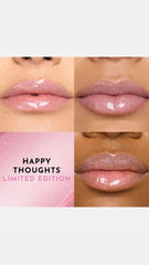Lawless gloss swatch shows pink shimmer for chic daytime glam.