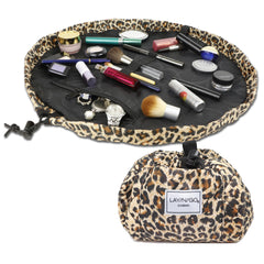 Lay-n-Go Cosmo leopard layflat bag open showing organized makeup on a vanity
