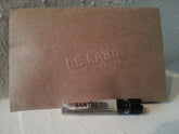 Le Labo Santal 33 sample bottle close-up for testing the iconic woody-amber scent