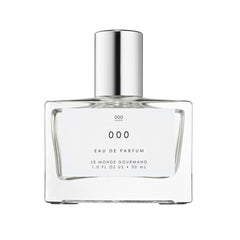 Le Monde Gourmand 000 Spray bottle close-up highlighting sandalwood notes for everyday elegance.