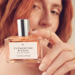 Le Monde Gourmand Clementine Bisous sandalwood note adds warm, lasting depth.