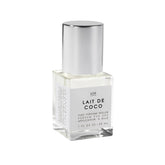 Le Monde Gourmand Lait de Coco perfume oil bottle on vanity shows creamy coconut aroma.