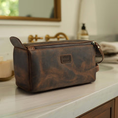 Leather Village Premium Leather Travel Toiletry Bag side view emphasizes compact size for easy packing