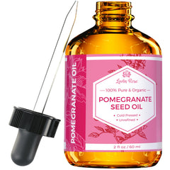 Leven Rose Pomegranate Oil bottle close-up showing pure formula and amber glass protection for potency.
