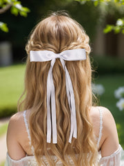 LFOUVRE tassel bow clip closeup — soft material.