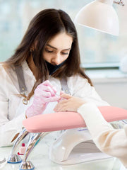 Lionvison arm rest with strong bearing feet secures tools during nail sessions.