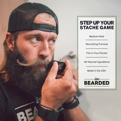 Live Bearded Mustache Wax Stick in use shows hands shaping stache for day-long hold.