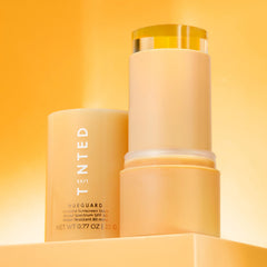 Live Tinted Hueguard with water splash to emphasize sweat and water resistance