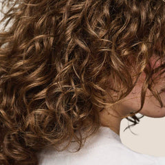Living Proof Curl Enhancer application demo shows scrunching to enhance curls
