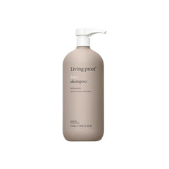Living Proof No Frizz Shampoo bottle front demonstrates frizz control for smoother, more manageable hair.