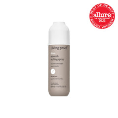Living Proof No Frizz Smooth Styling Spray bottle closeup shows a mist for weightless styling.
