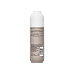 Living Proof No Frizz Smooth Styling Spray hair-smoothing-action image highlights frizz reduction.