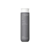 Living Proof Perfect Hair Day Shampoo bottle close-up highlighting long-lasting hydration.