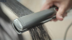 Lizze Extreme Professional Hair Straightener in-use on hair for frizz control and straight results.