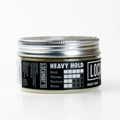 Lockhart's Heavy Hold swatch on finger reveals heavy hold and texture.